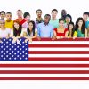 Large Group of People Holding American Flag Board